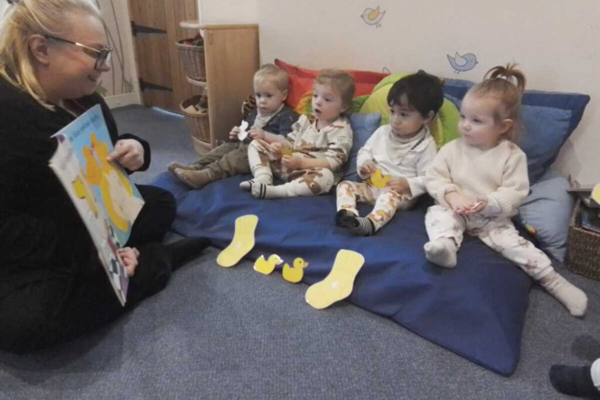 Peacehaven nursery reading to children