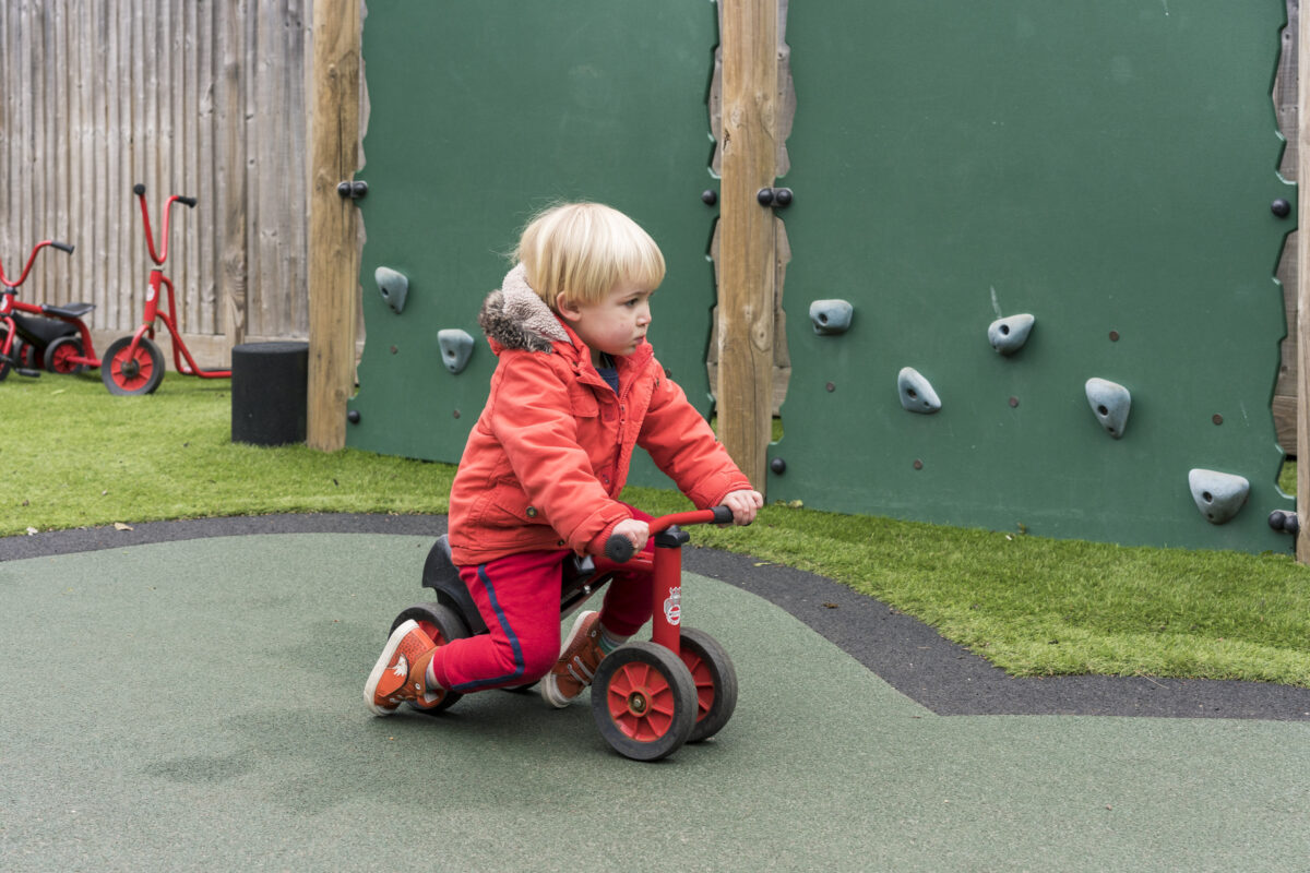 Toddler Room Riding a Trike
